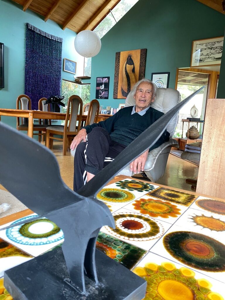 Fred Graham with Kāhu in his home in Waiuku